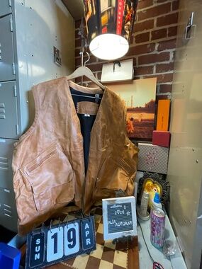 vintage brown leather vest is consistent w utility & survival  by the brand TKO